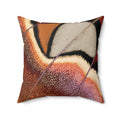 A square decorative throw pillow featuring an abstract, textured brushstroke pattern in warm tones of orange, brown, beige, and black, with a diagonal purple line accent, shown on a plain white background.